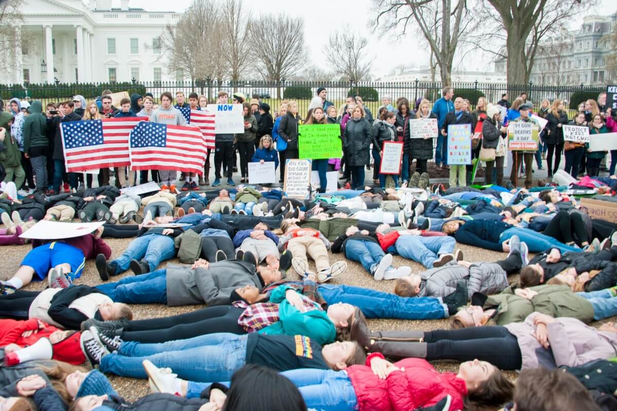 Students protest gun law by staging a lie-in outside the whitehouse. Source: Rena Schild/Shutterstock.