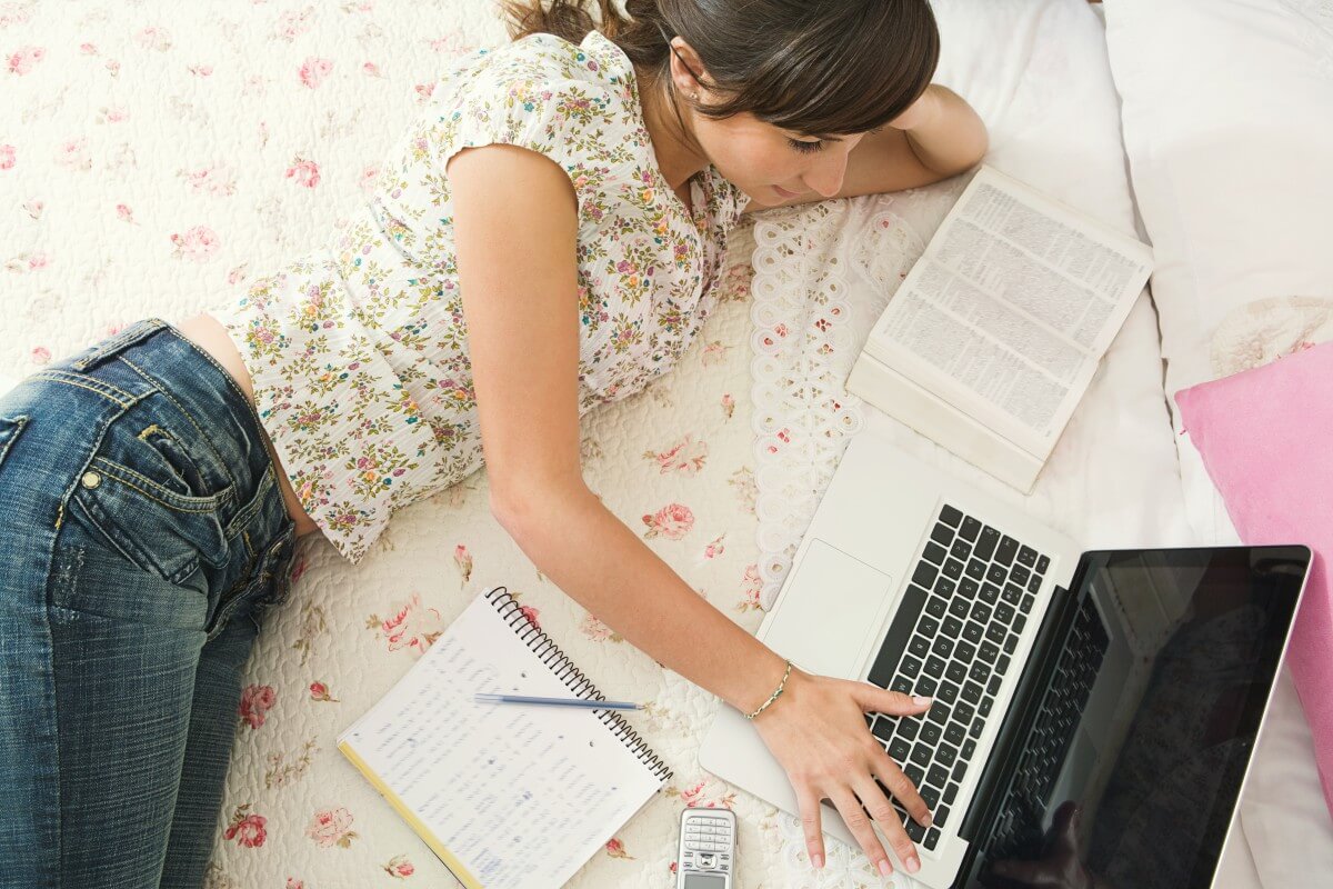 Study bed. Girl with Notebook in her Room.