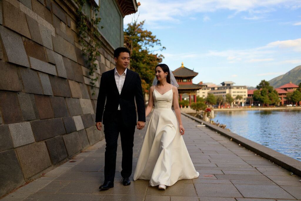 A couple walk along an alley near Houhai Lake in Beijing. Source: Noel Celis/