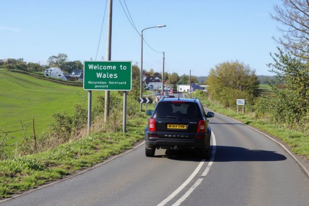 A vechile travels past a ‘Welcome to Wales’ sign on the Wales/England border near Hereford in Herefordshire, England. Source: Geoff Caddick/