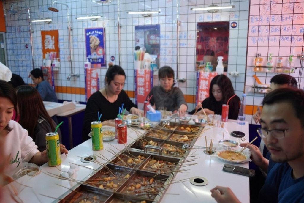 Though eating out with friends is a great way to socialise it can be heavy on the pocket. Source: GREG BAKER /