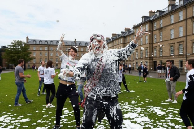 First year students at the University of St Andrews participate in the annual Raisin Monday shaving foam fight on the Lower College Lawn in St Andrews, eastern Scotland. Source: Andy Buchanan/