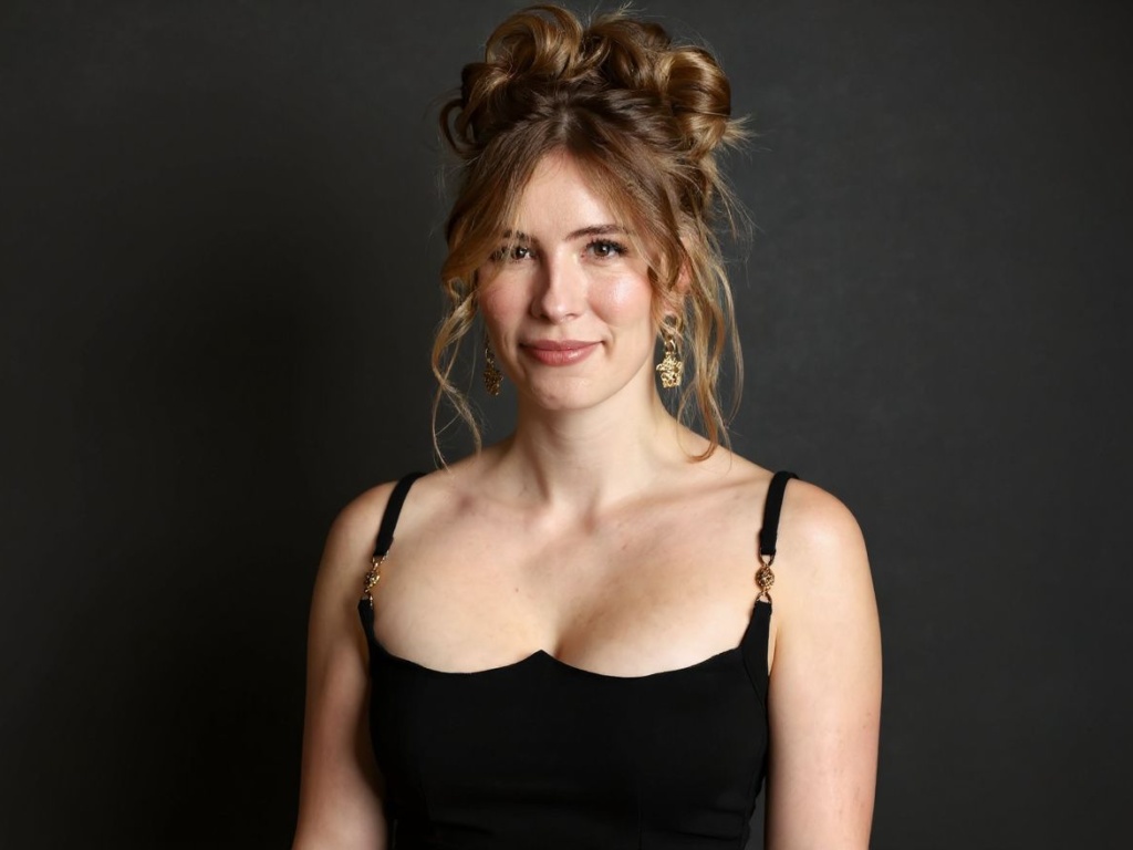 Emily Henry is a famous romance author who writes about love and psychology through fictional stories. Source: