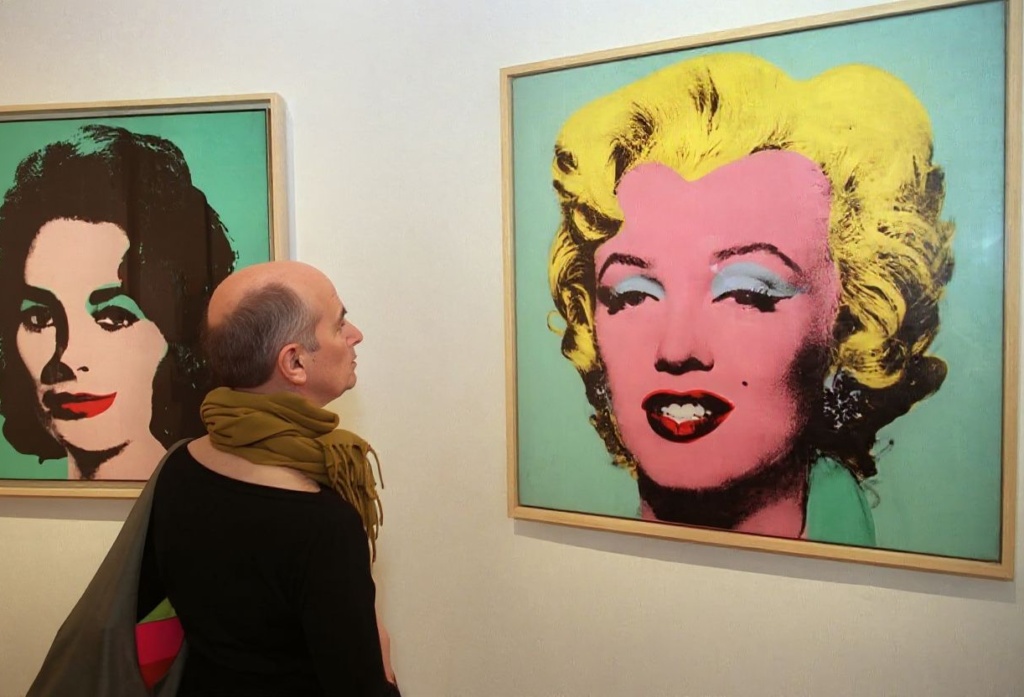 The richest men in the world often invest in art work like the Andy Warhol depicting Marilyn Monroe here. Source: Noocher Deghati/