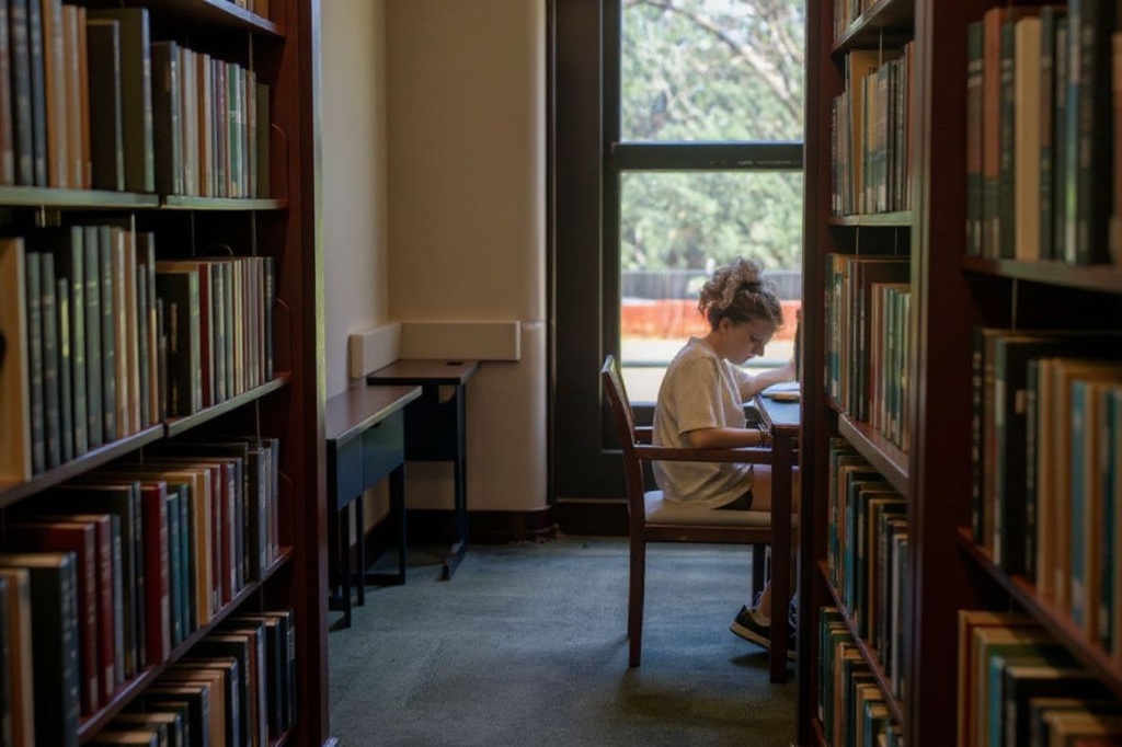 HOUSTON, TEXAS – AUGUST 29: Bio Scientist major Emma Scales studies in the Rice University Library on August 29, 2022 in Houston, Texas. U.S. President Joe Biden has announced a three-part plan that will forgive hundreds of billions of dollars in federal student loan debt. Since announced, the plan has sparked controversy as critics have begun questioning its fairness, and addressing concerns over its impact on inflation.   Brandon Bell/Getty Images/ (Photo by Brandon Bell / GETTY IMAGES NORTH AMERICA / Getty Images via )