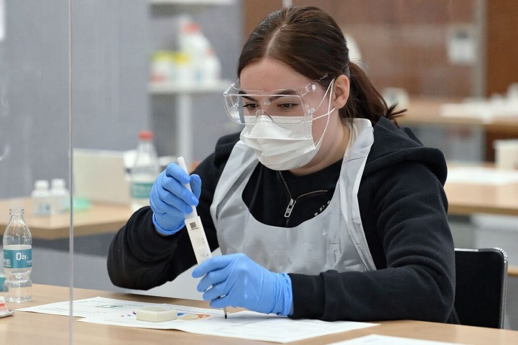 A student conducting research in the University lab. Source: Photo  Paul ELLIS /