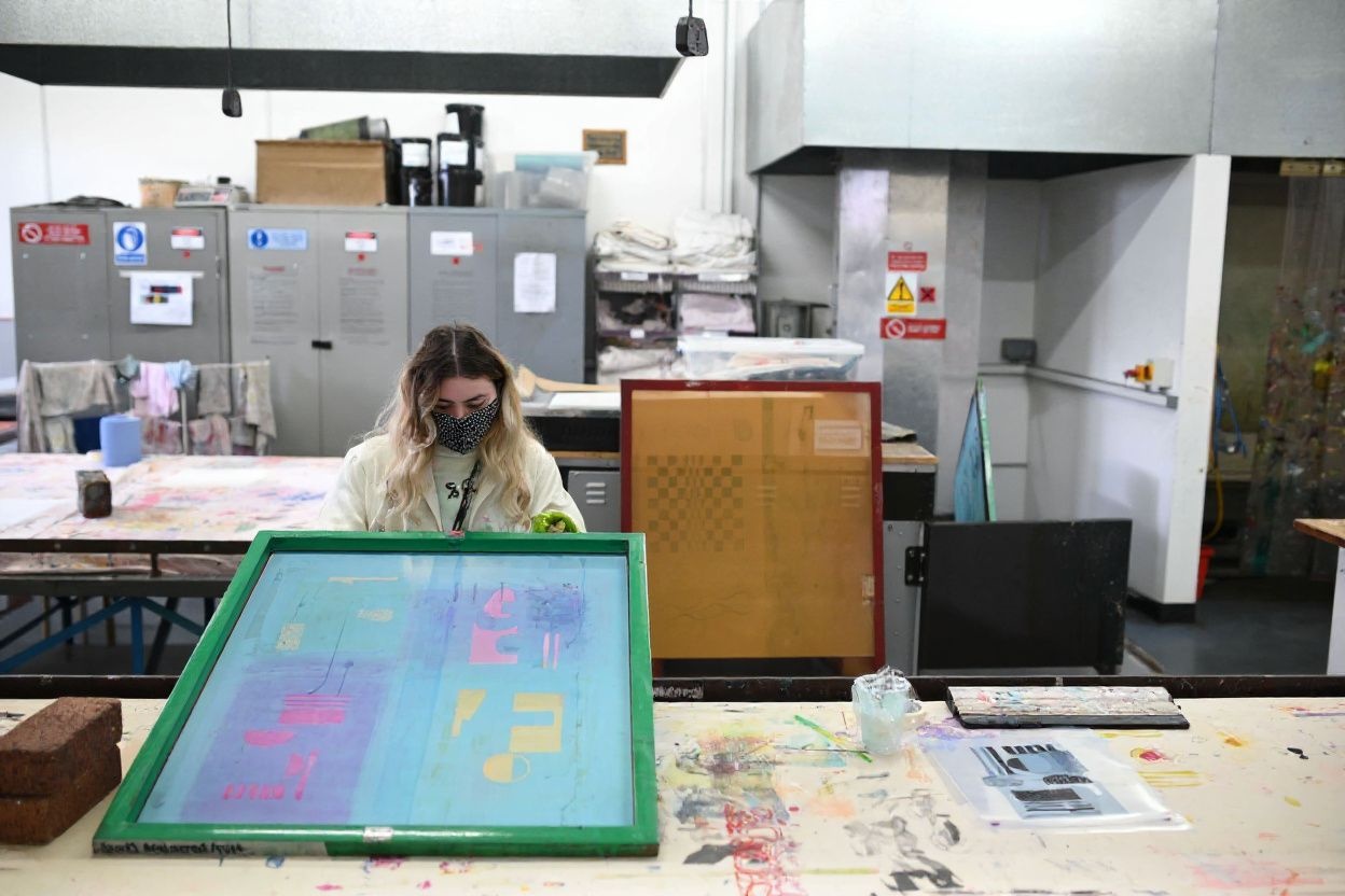 A Bachelor of Arts in Fashion and Textile Design degree in the UK typically requires you to prove your English proficiency through a test. Source: Oli Scarff/