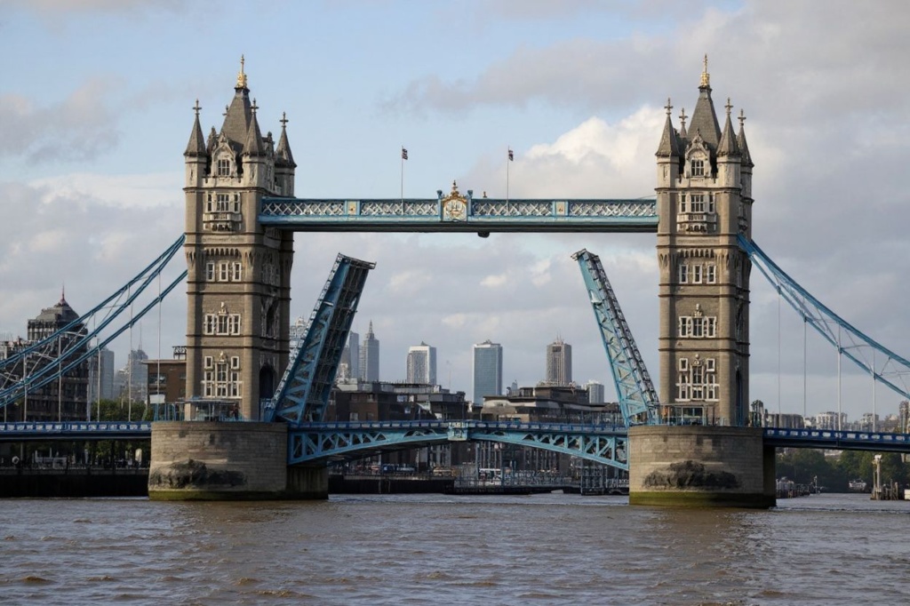 Tower Bridge is pictured, stuck in an open position due to a technical fault, in central London on August 9, 2021. – London’s iconic Tower Bridge remained closed to traffic on August 9 after suffering a technical fault, resulting in it being unable to close. (Photo by Tolga Akmen / )