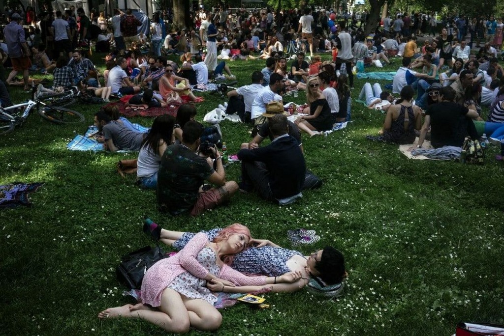 People sit on the grass in a park on May 29, 2016 in downtown Sofia. (Photo by DIMITAR DILKOFF / )