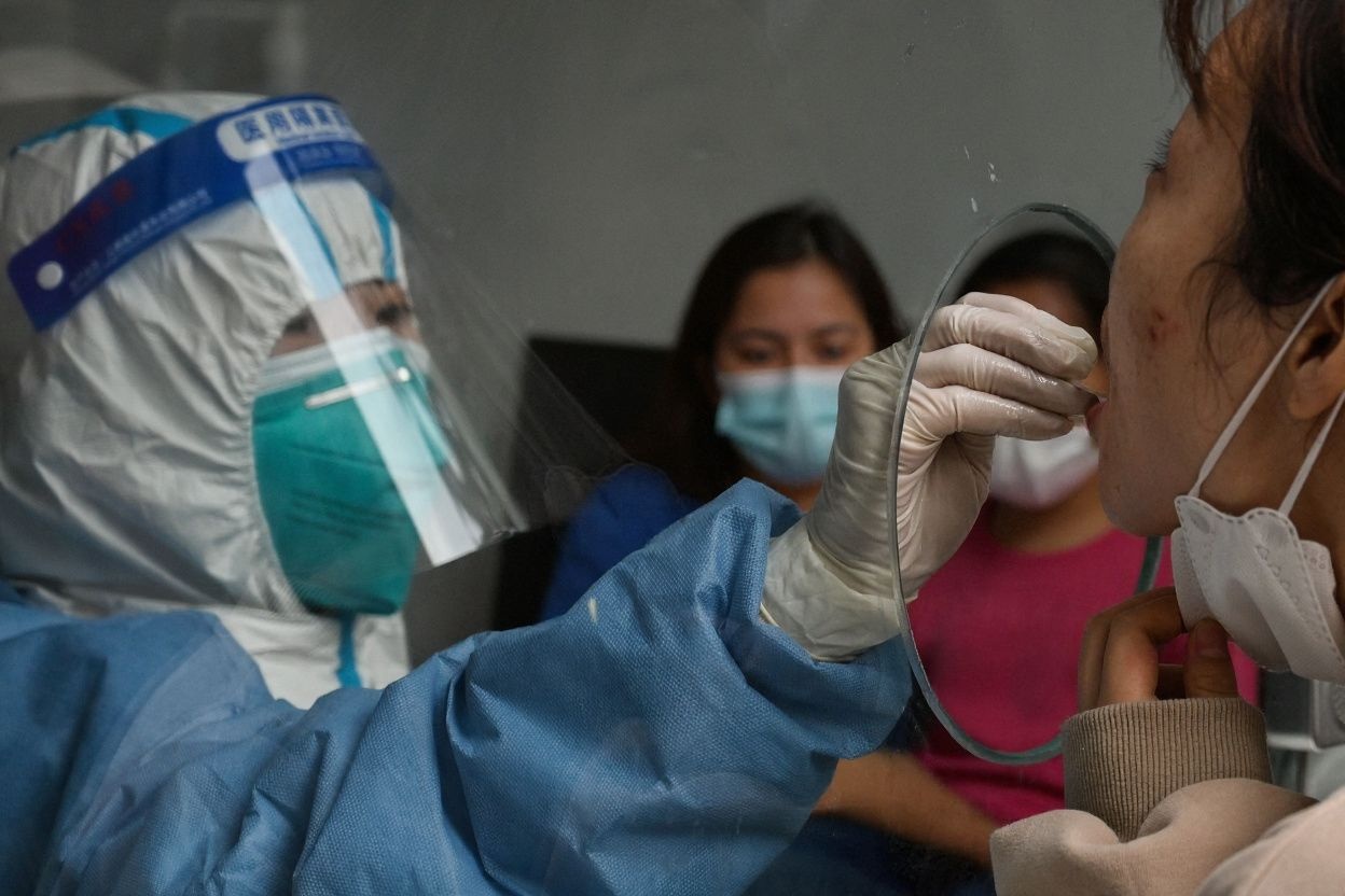 Reports have emerged of families being separated and students transported to isolation facilities to manage the outbreak. Source: Hector Retamal/