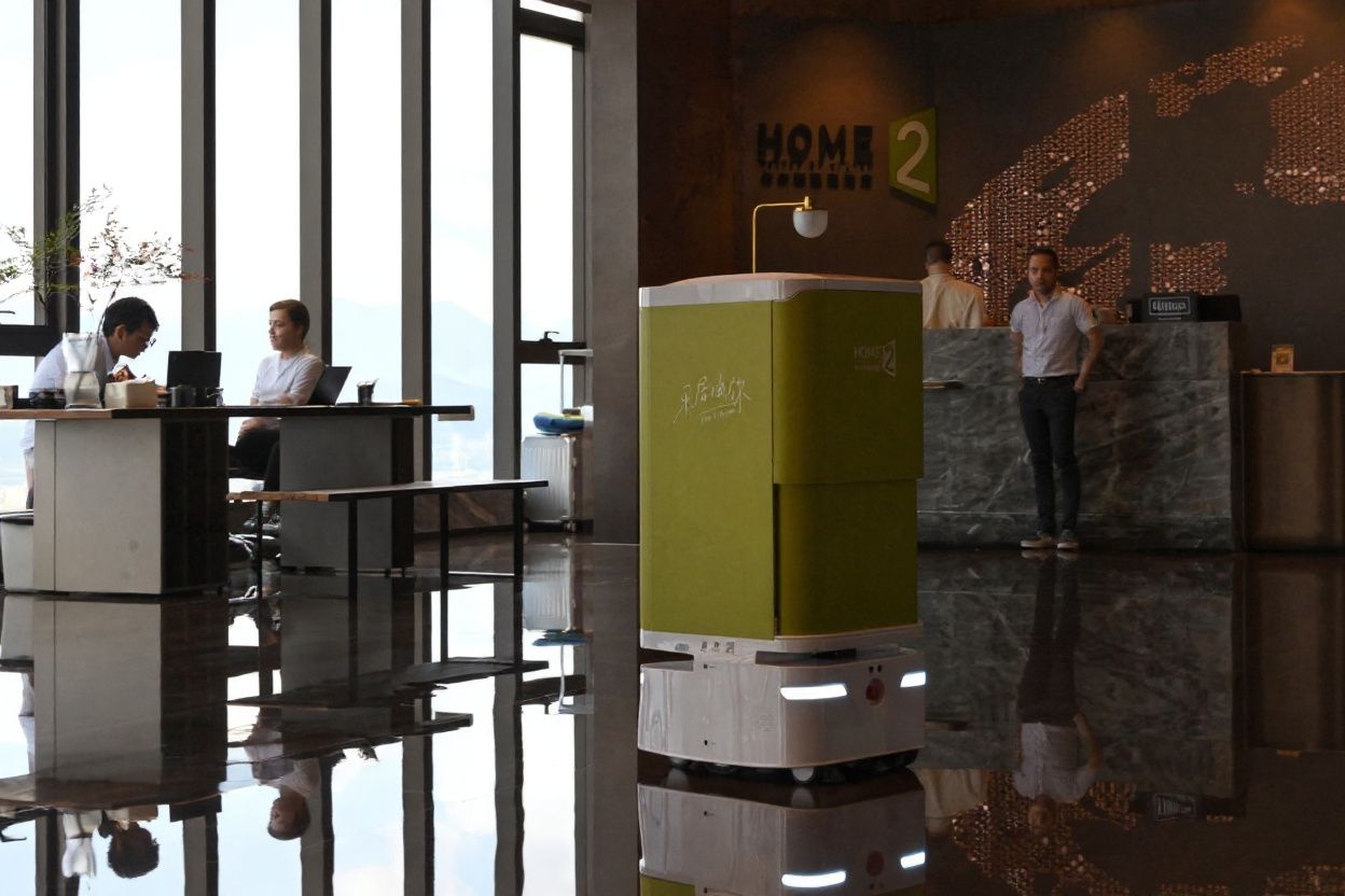 A couple of decades ago, perhaps the idea of being served by a robot was merely a fantasy., shot on Canon EOS R5, 24-70mm f/2.8 lens, RAW photograph, unedited, candid moment, natural lighting, photojournalistic style | NEGATIVE: AI generated, artificial, computer generated, digital art, 3d render