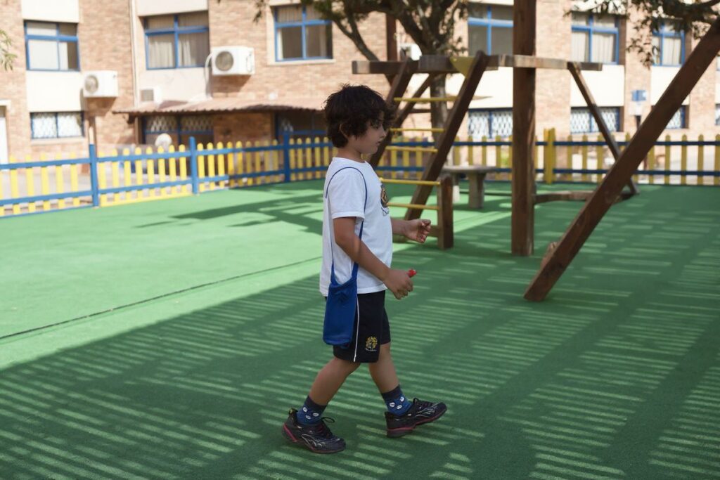 Egyptian student Farris Hamid, 6, walks in the playground of the Egypt British International school in Cairo on June 12, 2013.  PHOTO / KHALED DESOUKI (Photo by KHALED DESOUKI / )