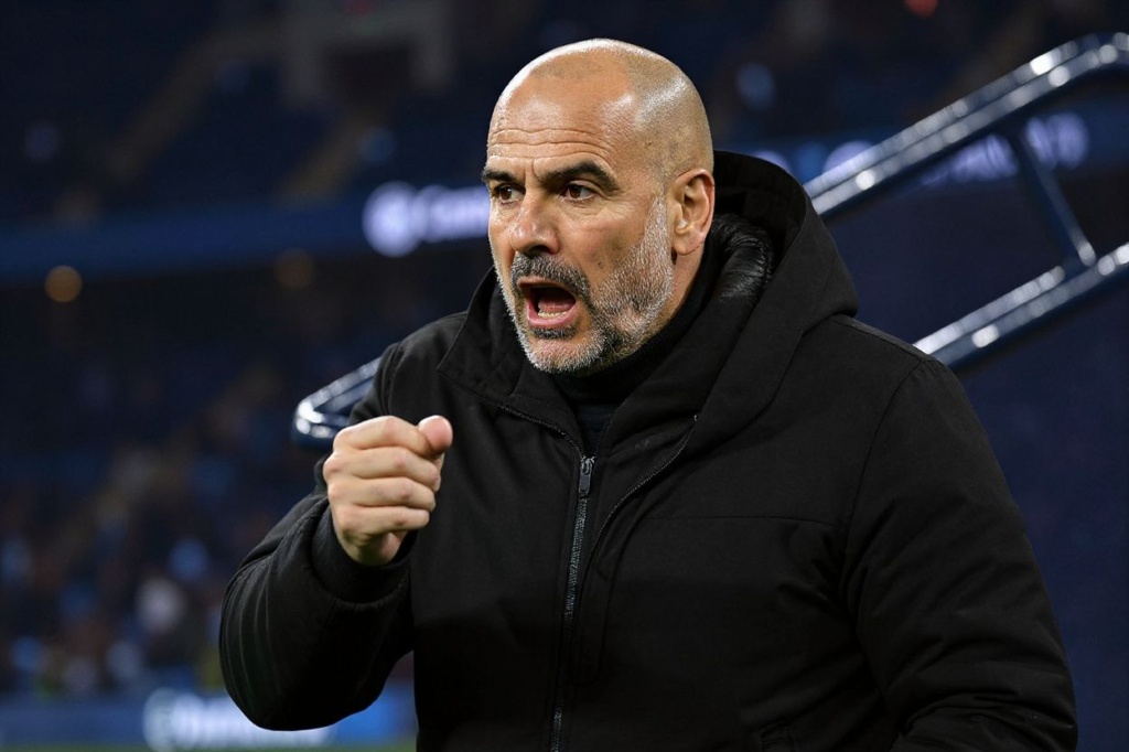 Manchester City’s Spanish manager Pep Guardiola reacts during the UEFA Champions League round of 16 second-leg football match between Manchester City and RB Leipzig at the Etihad Stadium in Manchester, north west England, on March 14, 2023. (Photo by Oli SCARFF / )