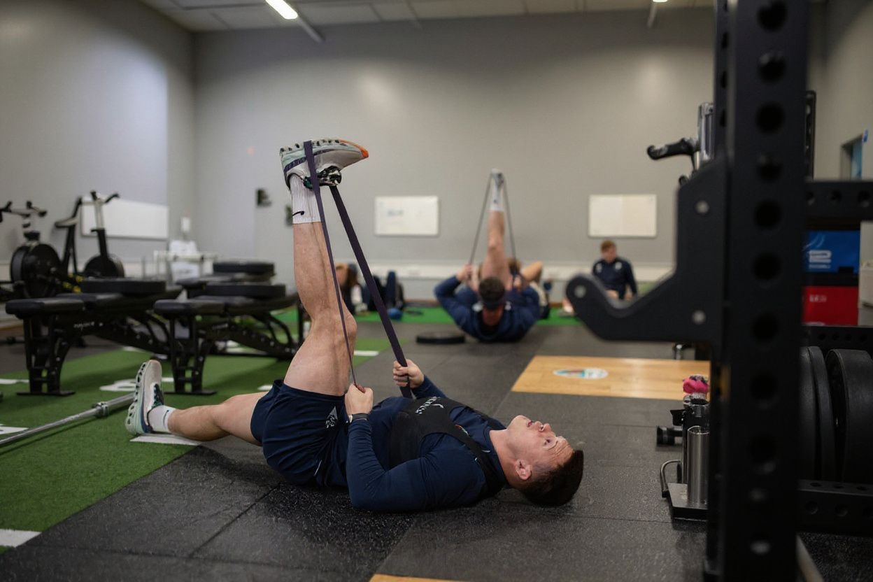 Most sports scholarships offer free access to their university’s gym facilities and equipment., shot on Sony A7R IV, 85mm f/1.4 lens, RAW photograph, unedited, candid moment, natural lighting, photojournalistic style | NEGATIVE: AI generated, artificial, computer generated, digital art, 3d render