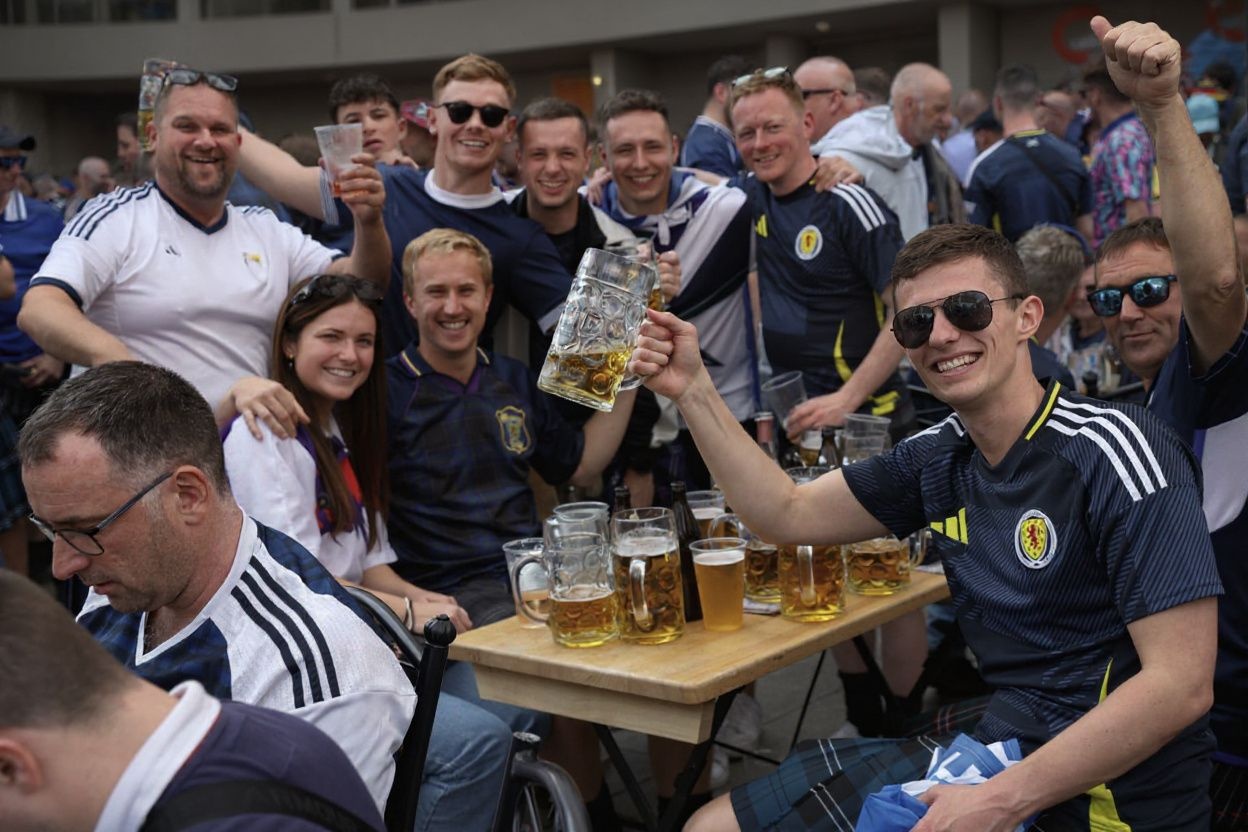 If you’re a sports enthusiast, chances are that you may enjoy drinking with fellow fans at any sports events., shot on Nikon D850, 35mm f/1.8 lens, RAW photograph, unedited, candid moment, natural lighting, photojournalistic style | NEGATIVE: AI generated, artificial, computer generated, digital art, 3d render