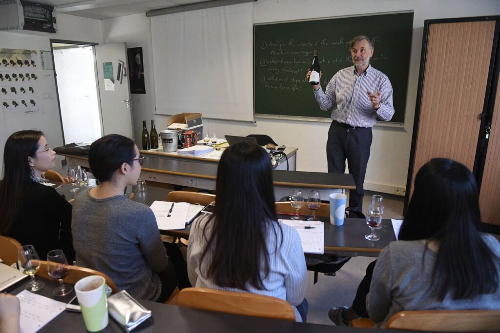 Pre-sessional English courses are among the most common pathways for international students to improve their English proficiency required to undertake most study programmes in UK universities (Photo by PHILIPPE DESMAZES / )