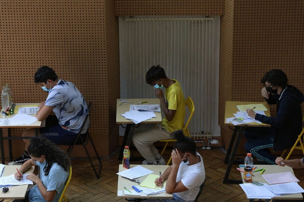 High school students take the French exam, the first test session of the 2021 baccalaureate (high school graduation exam) on June 17, 2021 at the Pasteur high school in Strasbourg, eastern France. (Photo by FREDERICK FLORIN / )