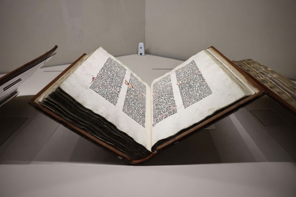 “The Biblia Latina Gutemberg Bible”, the first book printed in Europe using movable type, in 1455, displayed as part of the exhibition “Print! Gutenberg’s Europe at the Bibliotheque Francois Mitterand (BnF) in Paris. Source: Anne-Christine Poujoulat/