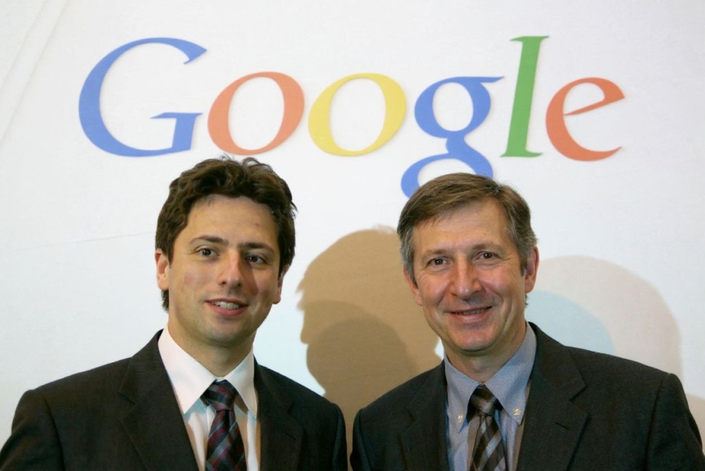 Google founders Sergey Brin (L) and Larry Page pose for photographers prior to presenting their new Google Print product at the Frankfurt Book Fair 07 October 2004. (Photo by JOHN MACDOUGALL / )