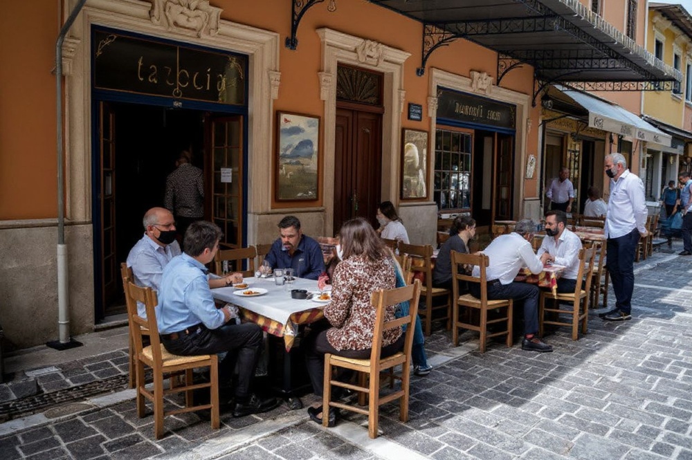 Restaurants and social life are opening up in countries like Greece, pictured here. Source: Angelos Tzortzinis/
