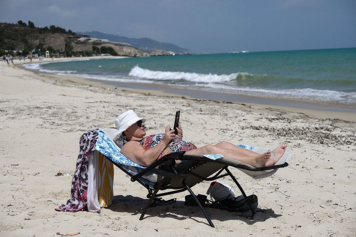 Suntanning on a windy beach is the perfect time to scroll social media, not when you’re cramming for an exam. Source: