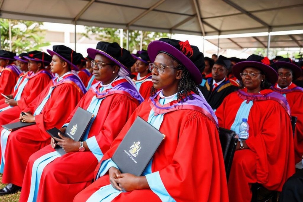 Doctors of Philosophy (PhD) hold their certificates as they attend a graduation ceremony at the University of Nairobi on December 15, 2023. (Photo by SIMON MAINA / )