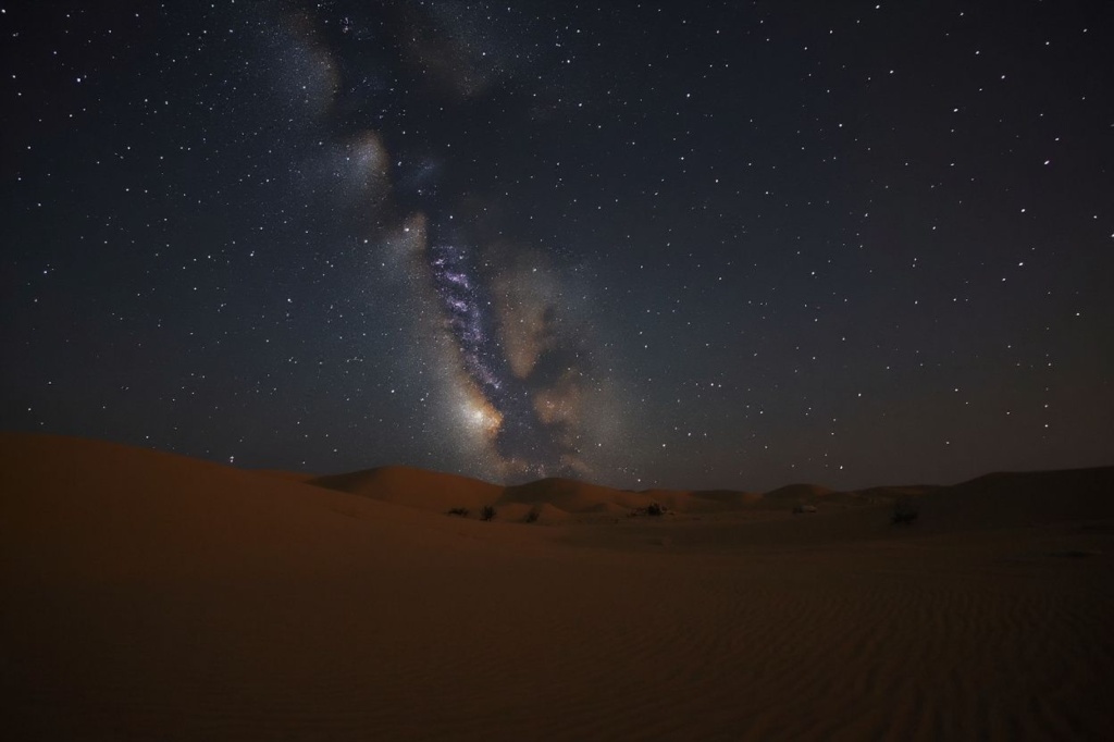 The Comet C/2022 E3 (ZTF) (C-R) is pictured early on February 2, 2023, from the al-Salmi desert, some 120 kilometres northwest of Kuwait City. The comet, visible to the naked eye, is shooting past Earth and the Sun for the first time in 50,000 years, astronomers say. (Photo by Yasser Al-Zayyat / )