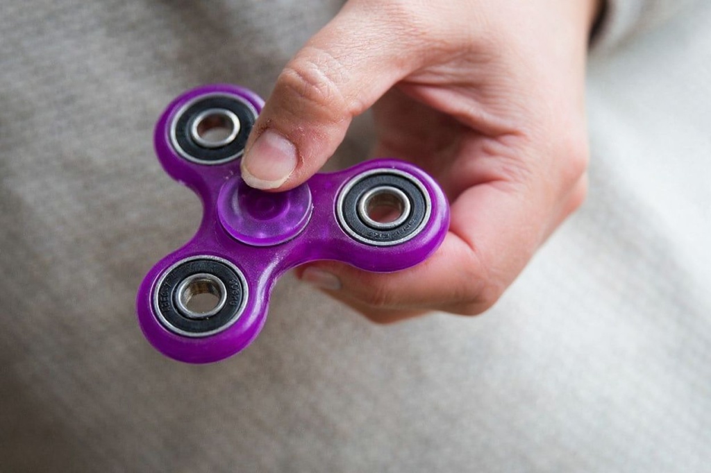 Fidget spinners are a great way to help you curb your social anxiety while travelling. Source: Drew Angerer/Getty Images North America/Getty Images/