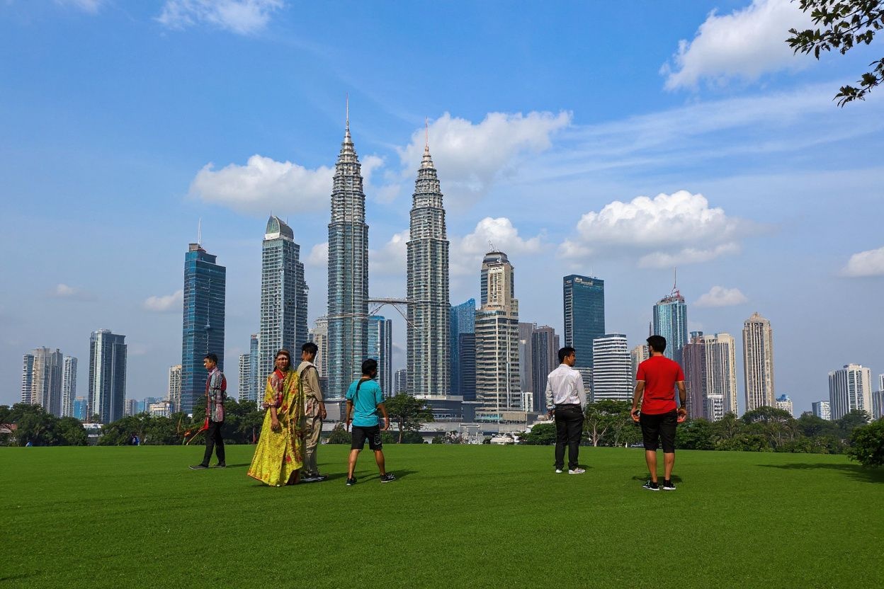 Malaysia is a melting pot of culture, and the country’s inexpensive cost of living makes it a great place to pursue your studies abroad., shot on Sony A7R IV, 85mm f/1.4 lens, RAW photograph, unedited, candid moment, natural lighting, photojournalistic style | NEGATIVE: AI generated, artificial, computer generated, digital art, 3d render