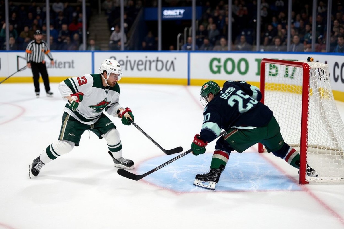 SEATTLE, WASHINGTON – MARCH 04: Joey Daccord #35 of the Seattle Kraken makes a save against Marco Rossi #23 of the Minnesota Wild at Climate Pledge Arena on March 04, 2025 in Seattle, Washington.   Steph Chambers/Getty Images/ (Photo by Steph Chambers / GETTY IMAGES NORTH AMERICA / Getty Images via )