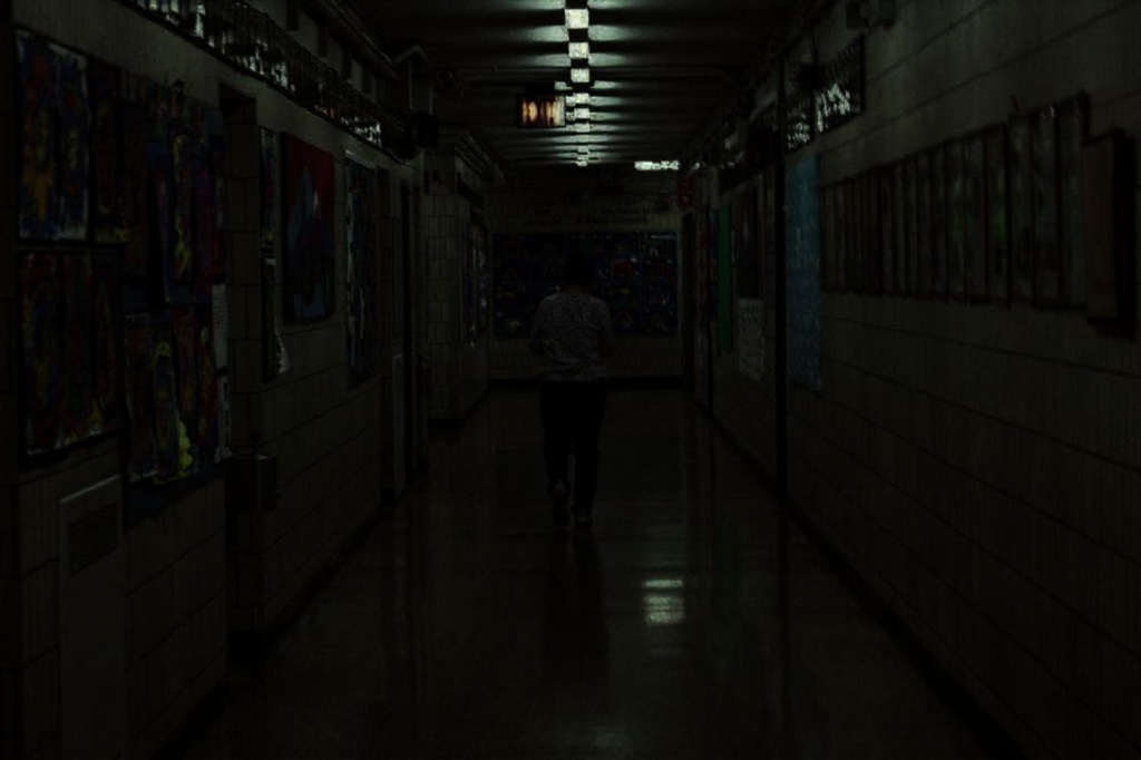 The difference of a school hallway from day to night can 
 make the environment all the more spookier. Source: