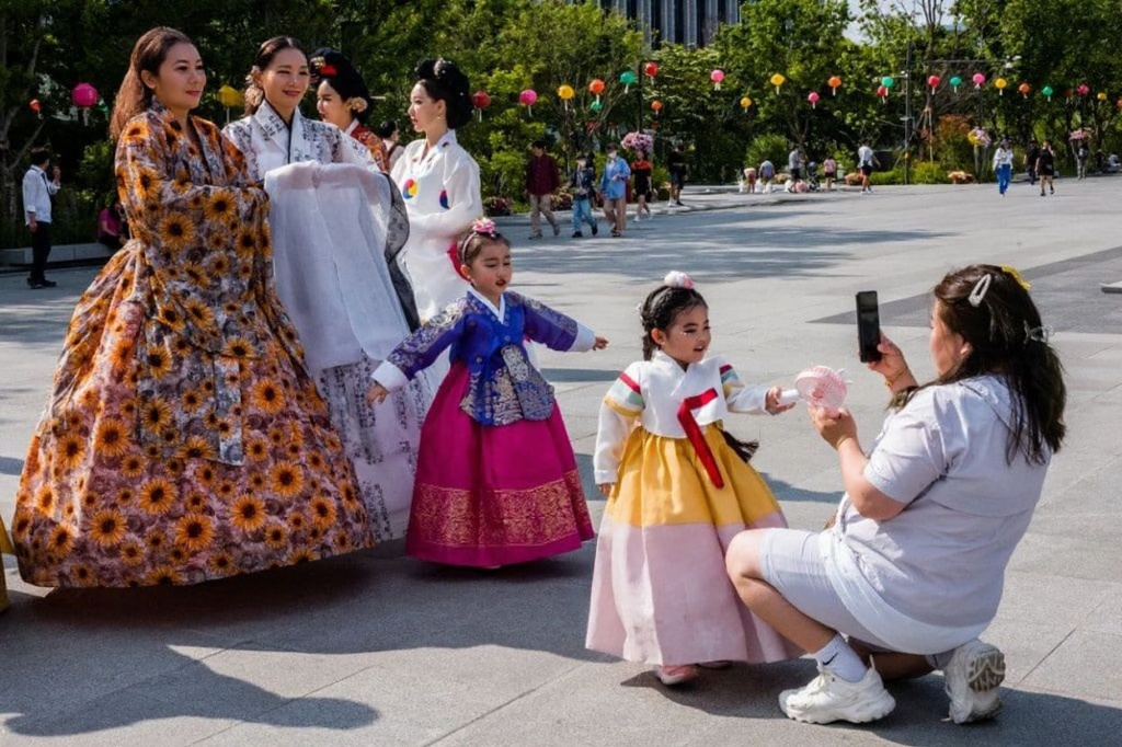 People wear traditional Hanbok clothing as they attend a culture festival in Seoul in Seoul on May 19, 2023. (Photo by ANTHONY WALLACE / )