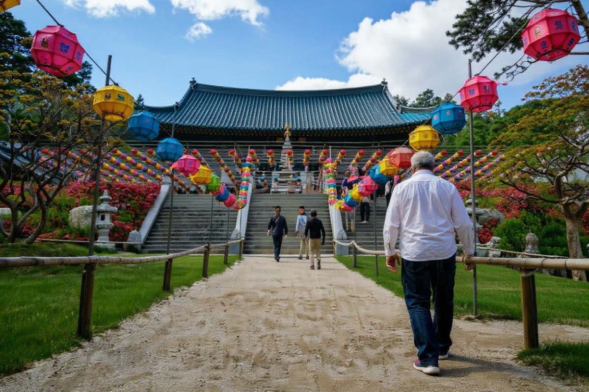 People visit the grounds of the Naksansa Temple, which follows the Jogye order of Korean Buddhism, in the Yangyang area of South Korea’s northeast coast on May 6, 2024. (Photo by ANTHONY WALLACE / )