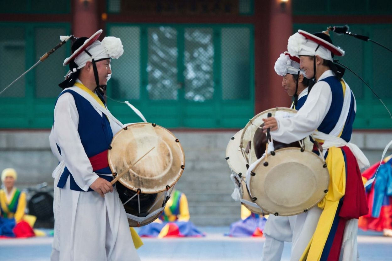 Studying in South Korea also means you’ll be able to experience a whole new culture and its own share of traditional music., shot on Canon EOS R5, 24-70mm f/2.8 lens, RAW photograph, unedited, candid moment, natural lighting, photojournalistic style | NEGATIVE: AI generated, artificial, computer generated, digital art, 3d render