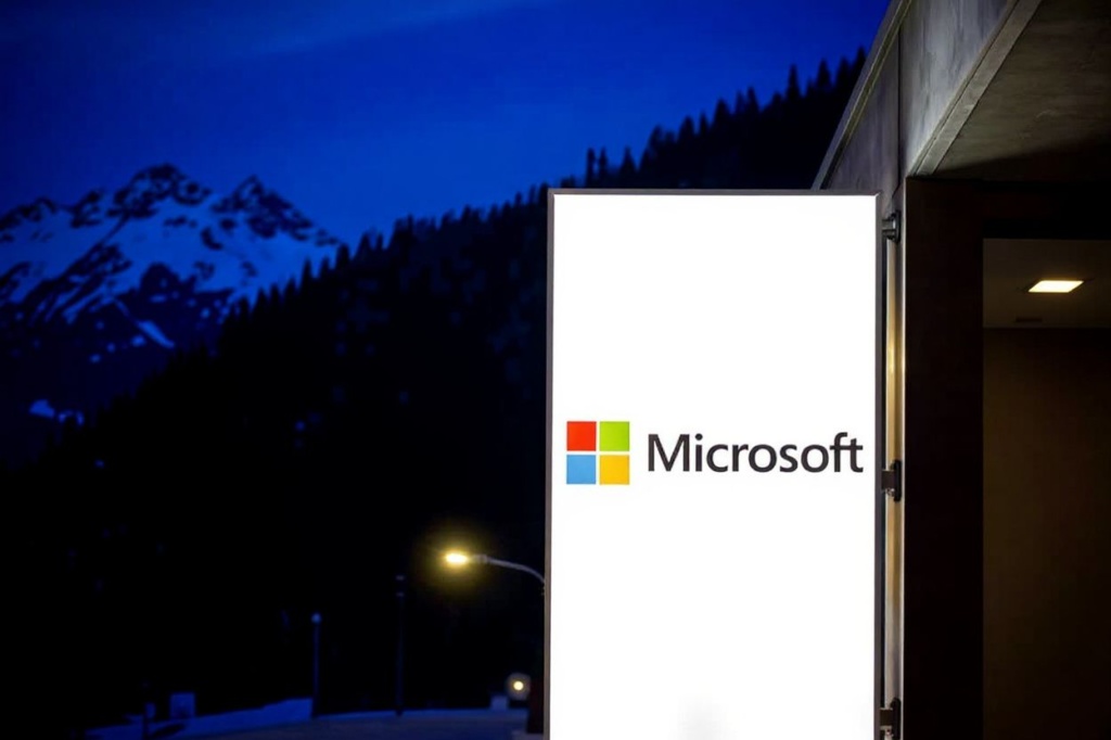 This photograph taken on January 19, 2023 shows the logo of the American corporation Microsoft displayed during the World Economic Forum (WEF) annual meeting in Davos. (Photo by Fabrice COFFRINI / )