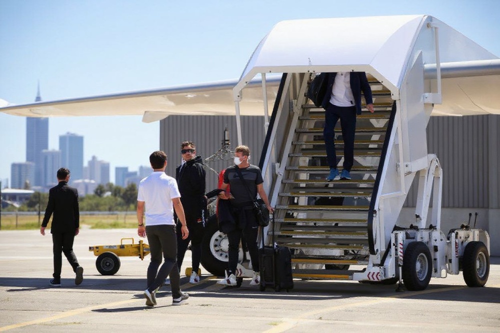 Tennis players and officials disembark from a flight after arriving in Melbourne on January 14, 2021, to quarantine ahead of the Australian Open tennis tournament. Source: William West/