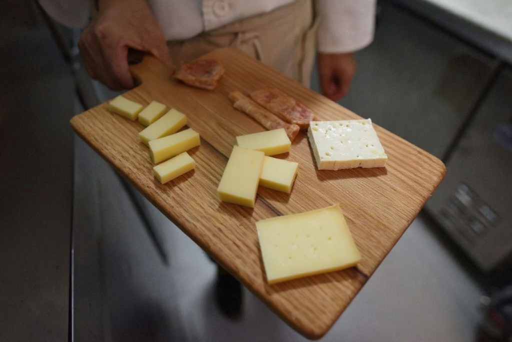 A charcuterie board usually has a sample of different cheeses. Source: