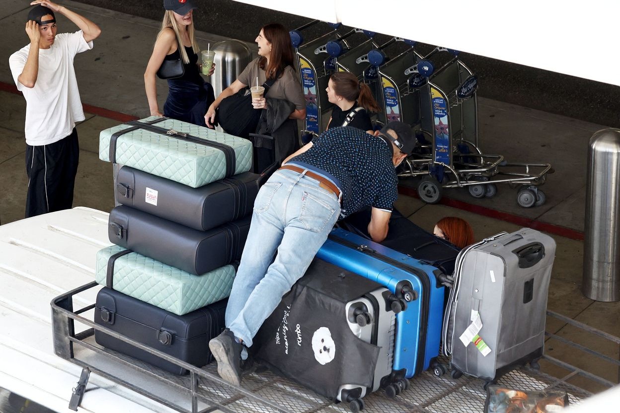 Look at the amount of luggage this poor guy has to handle. It can’t be all yours, right? Source: