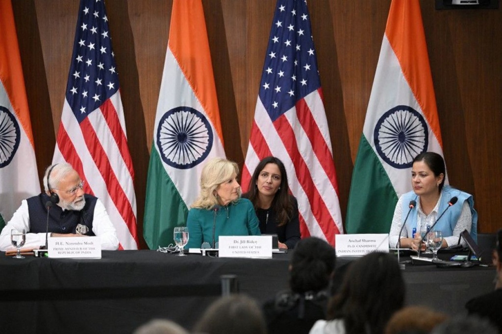 Indias Prime Minister Narendra Modi and US First Lady Jill Biden listen to Anchal Sharma, a PhD candidate at the Indian Institute of Technology, during a visit to the National Science Foundation in Alexandria, Virginia, on June 21, 2023. (Photo by Mandel NGAN / )