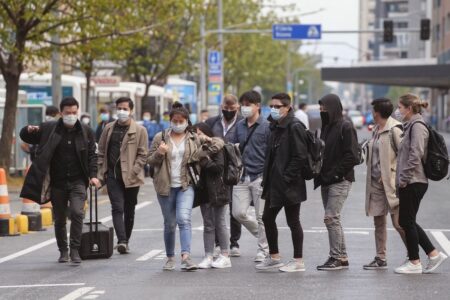 Fewer flights from China are flying to Australia, but some students are relieved by the delay